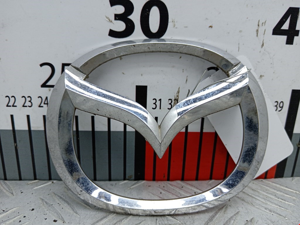 Эмблема (значок) Mazda 3 BK купить в России